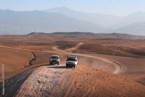 Off road 4x4 vehicle in dry mountainous desert area 