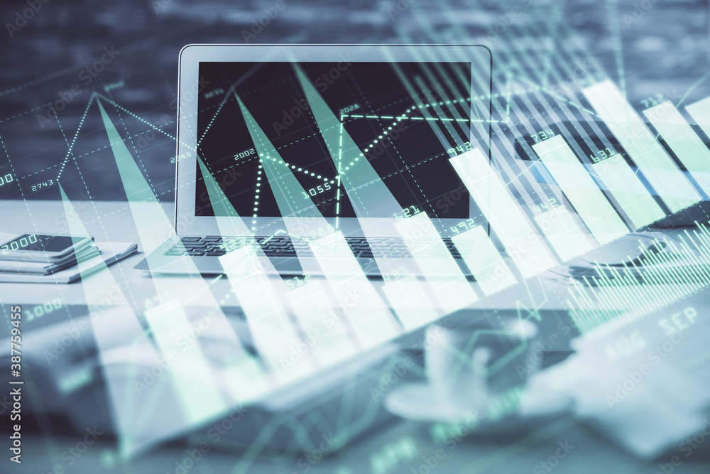 Stock market graph and table with computer background. Double exposure. Concept of financial analysis. Stock market graph and table with computer background. Double exposure. Concept of financial analysis.