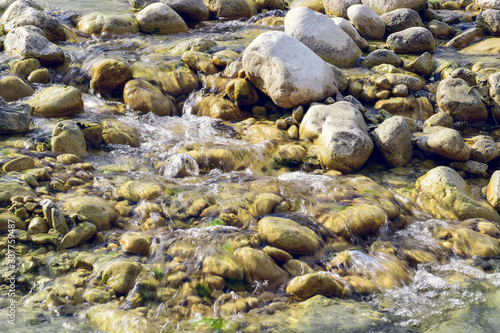 fresh flowing water of the rocky stream Mollarino amid the Italian Apennine mountains of the Lazio region,HDR image