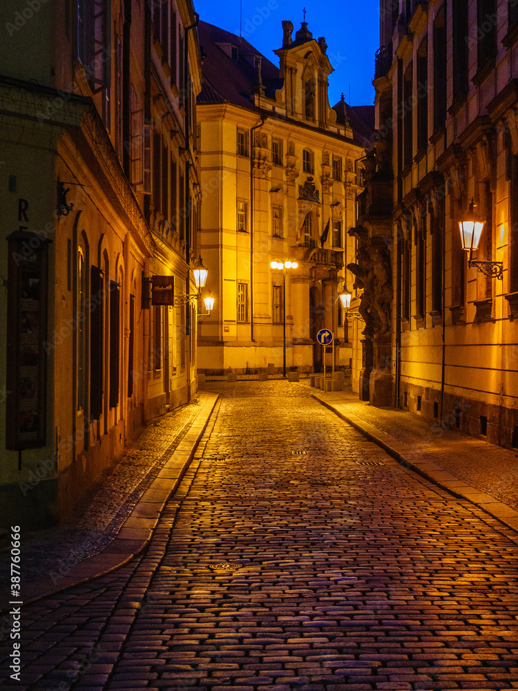 Night cobblestoned street in the historic Prague's Old Town
