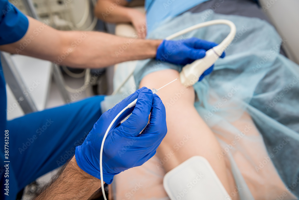 Cardiologist use tubes and ultrasound for radiofrequency catheter ablation. Cardiologist use tubes and ultrasound for radiofrequency catheter ablation.