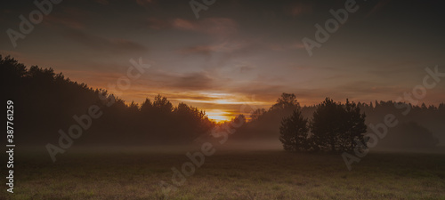 Sunset Sky iin the Foreground and Clouds in the Background. Timelapse. photo