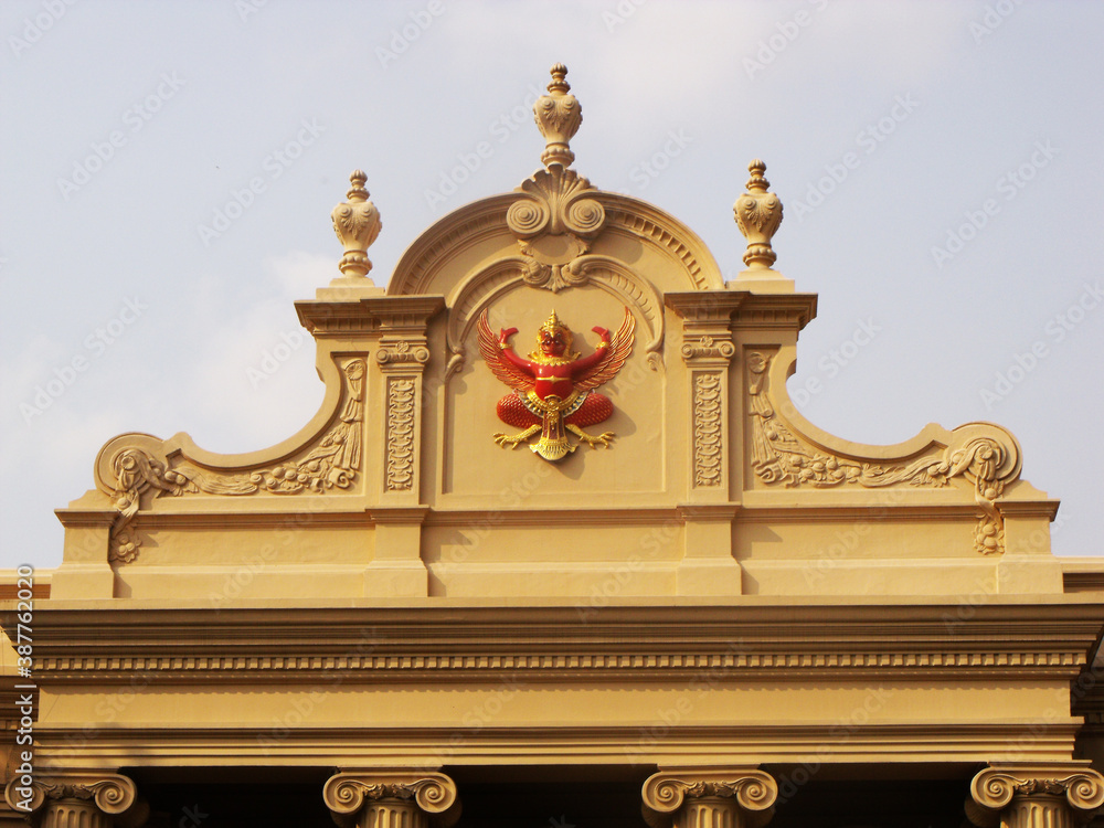 Bangkok, Thailand, January 25, 2013: Facade of a building with the shield of the Thai monarchy at the Royal Palace in Bangkok