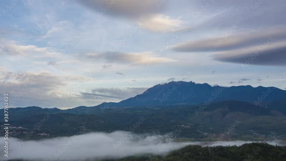 Time lapse sunrise MOUNT KINABALU, moving clouds over a villages. Taken at RANAU, SABAH, BORNEO. time lapse motion zoom out Time lapse sunrise MOUNT KINABALU, moving clouds over a villages. Taken at RANAU, SABAH, BORNEO. time lapse motion zoom out