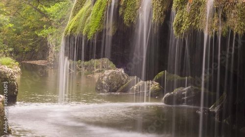 The unique beautiful Bigar waterfall full of green moss, Bozovici, Caras-Severin, Romania. Timelapse