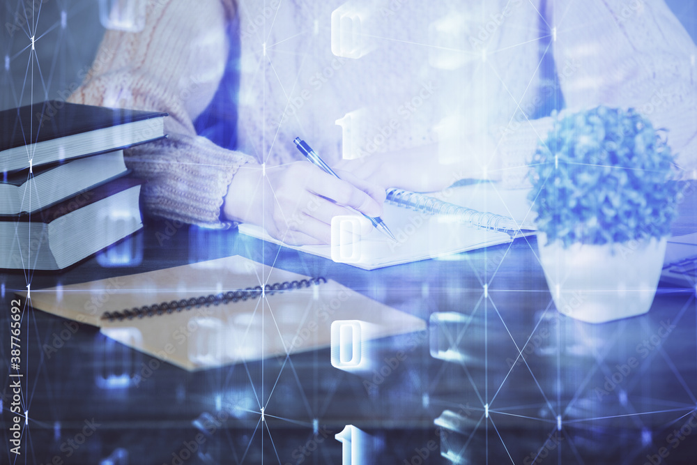 Double exposure of writing hands on background with data solution hologram on front. Technology concept. Close up Double exposure of writing hands on background with data solution hologram on front. Technology concept. Close up