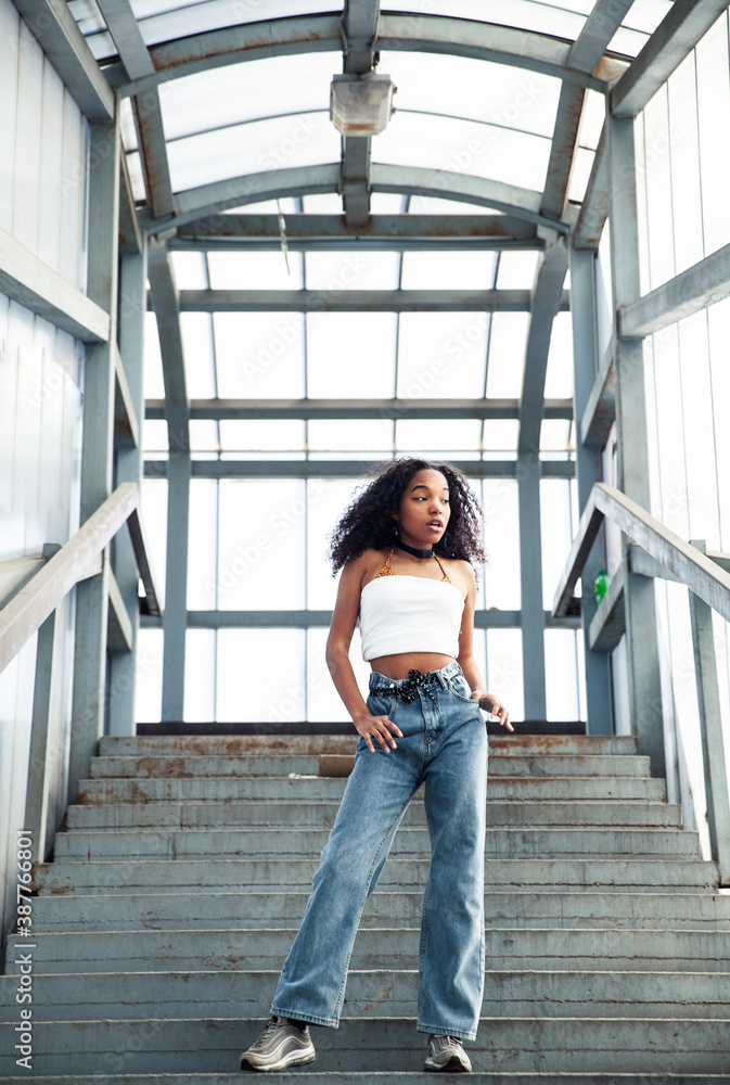 young cute teenage african girl in industrial zone happy smiling having fun, big city lifestyle fashion people young cute teenage african girl in industrial zone happy smiling having fun, big city lifestyle fashion people