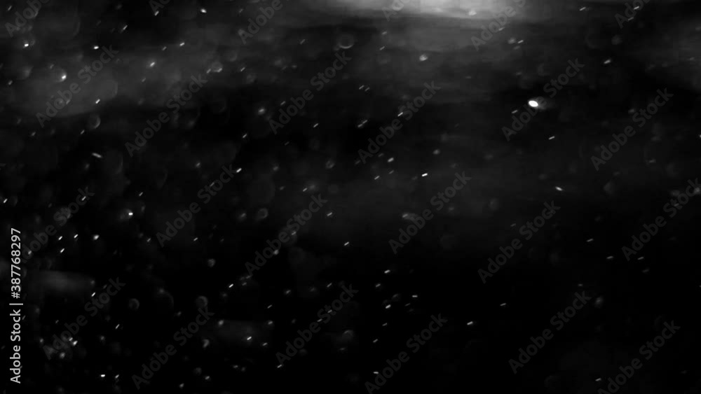 Beautiful Christmas snowflakes swirl and fall slowly against a black background. Christmas and New Year decoration Beautiful Christmas snowflakes swirl and fall slowly against a black background. Christmas and New Year decoration