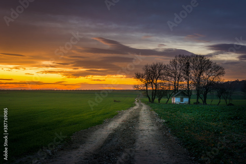 small lonely house at sunset