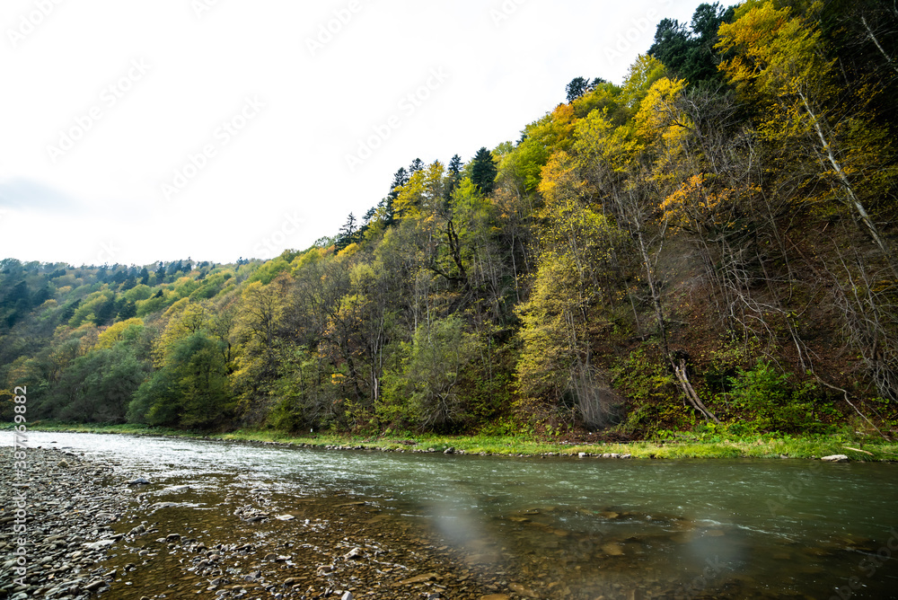 River in the mountains with pebbles in autumn River in the mountains with pebbles in autumn