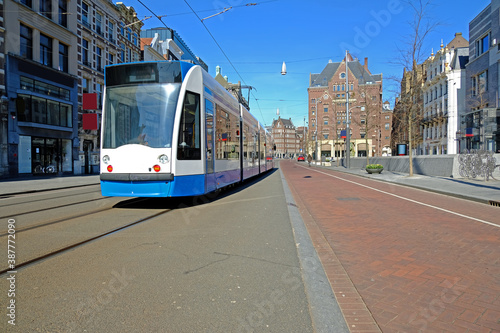 Tram driving at the Rokin in Amsterdam in the Netherlands