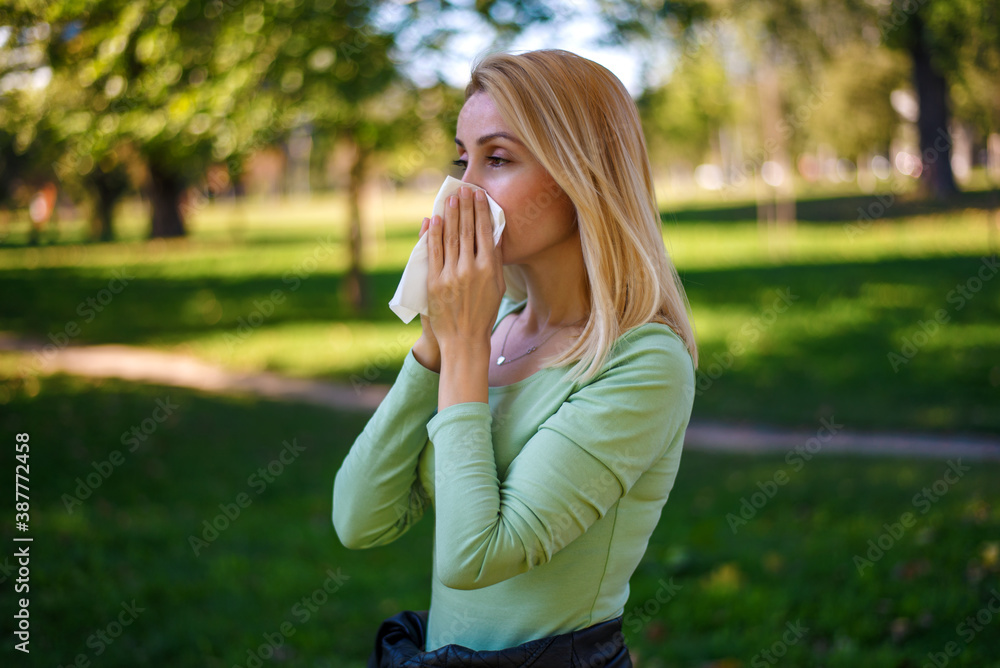 Pretty blonde blowing her nose. Pretty blonde blowing her nose.