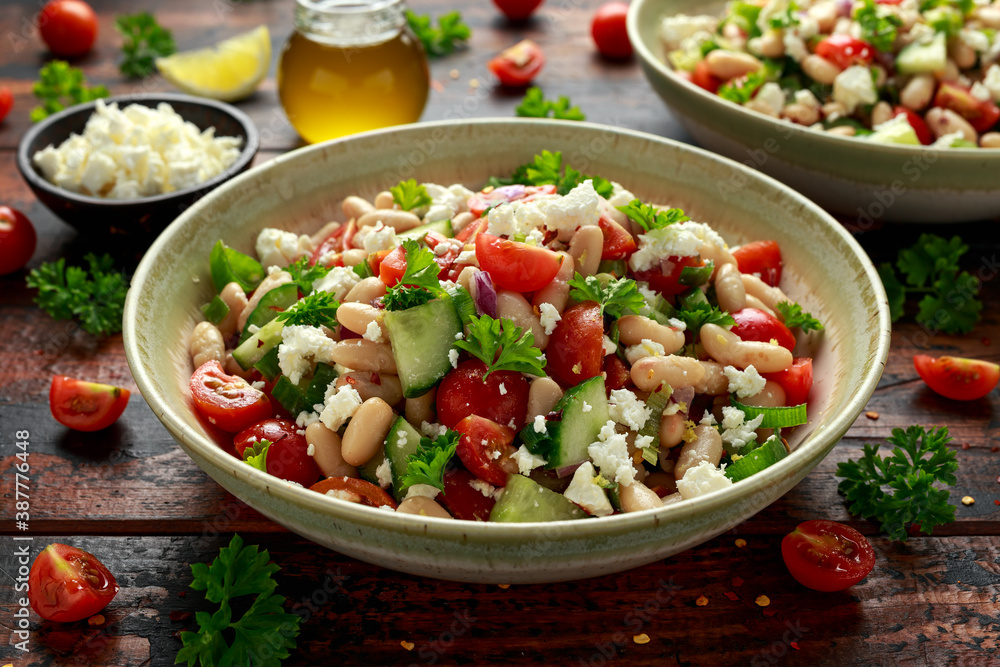 White Bean Salad with Cherry Tomatoes, Cucumber, Red onion, Feta cheese and parsley. Healthy vegetarian, vegan diet food White Bean Salad with Cherry Tomatoes, Cucumber, Red onion, Feta cheese and parsley. Healthy vegetarian, vegan diet food