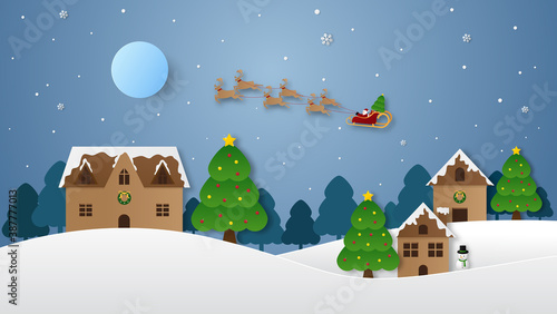 Santa claus on the sky coming city village with christmas tree in night time with snowfall. Christmas season and Happy new year season