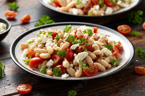 White Bean Salad with Cherry Tomatoes, Feta cheese and parsley. Healthy vegetarian, vegan food