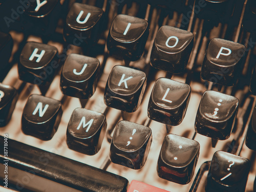 Close up of old fashioned typewriting machine. Conceptual image publishing, blogging, author or writing. photo