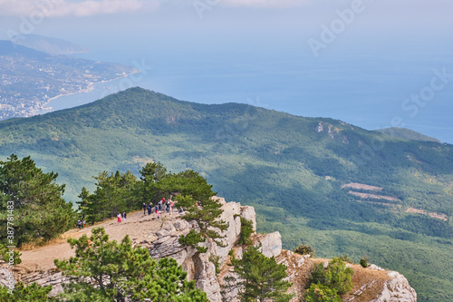 Crimean mountains. Tourists on the observation deck of the Ai Petri plateau.