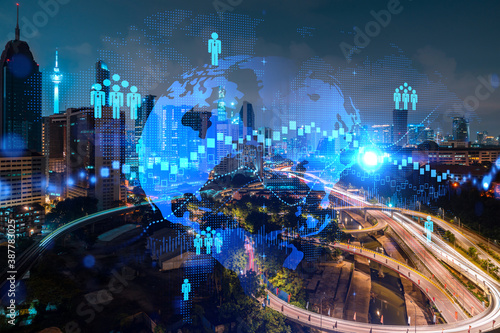 Glowing Social media icons on night panoramic city view of Kuala Lumpur  Malaysia  Asia. The concept of networking and connections between people and businesses in KL. Double exposure.