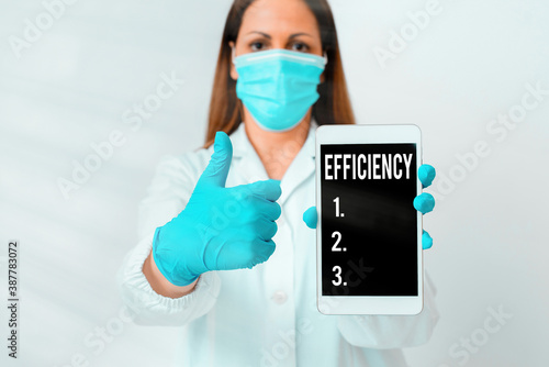 Conceptual hand writing showing Efficiency. Concept meaning ability to avoid wasting materials, efforts, in doing something Laboratory technician featuring paper accessories smartphone photo