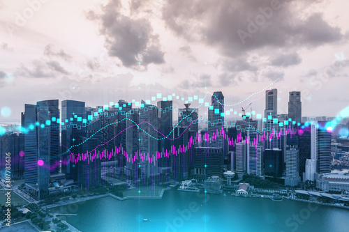 Glowing FOREX graph hologram  aerial panoramic cityscape of Singapore at sunset. Stock and bond trading in Asia. The concept of fund management. Double exposure.