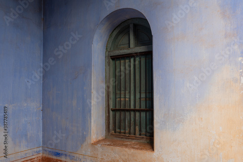 green window on old retro building.