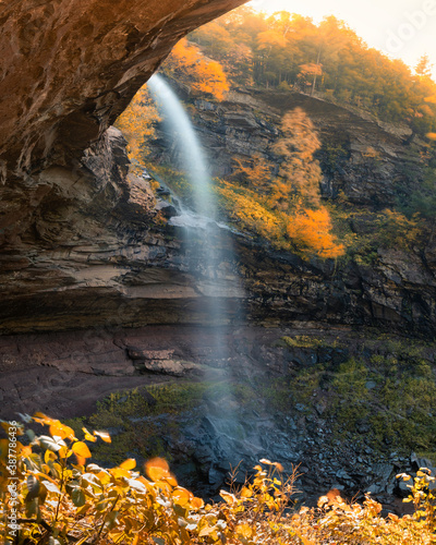 Large waterfall surrounded by vibrant fall foliage color. Kaaterskill Falls, Woodstock New York photo