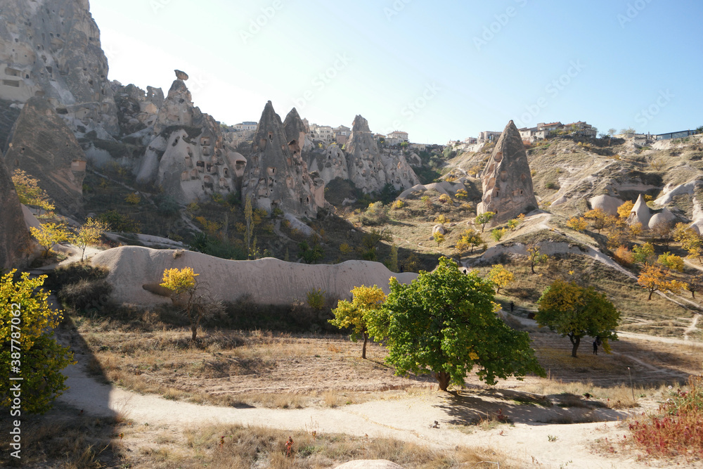 Ancient cave town near Goreme, Cappadocia, Turkey. Beautiful landscape on a summer sunny day. Historical attraction at Cappadocia.