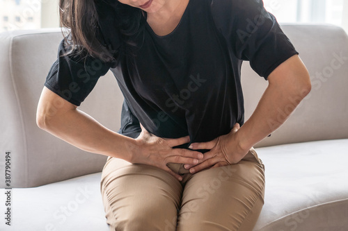 Bild auf Leinwand Abdominal pain in woman with stomachache illness from menstruation cramps, stoma