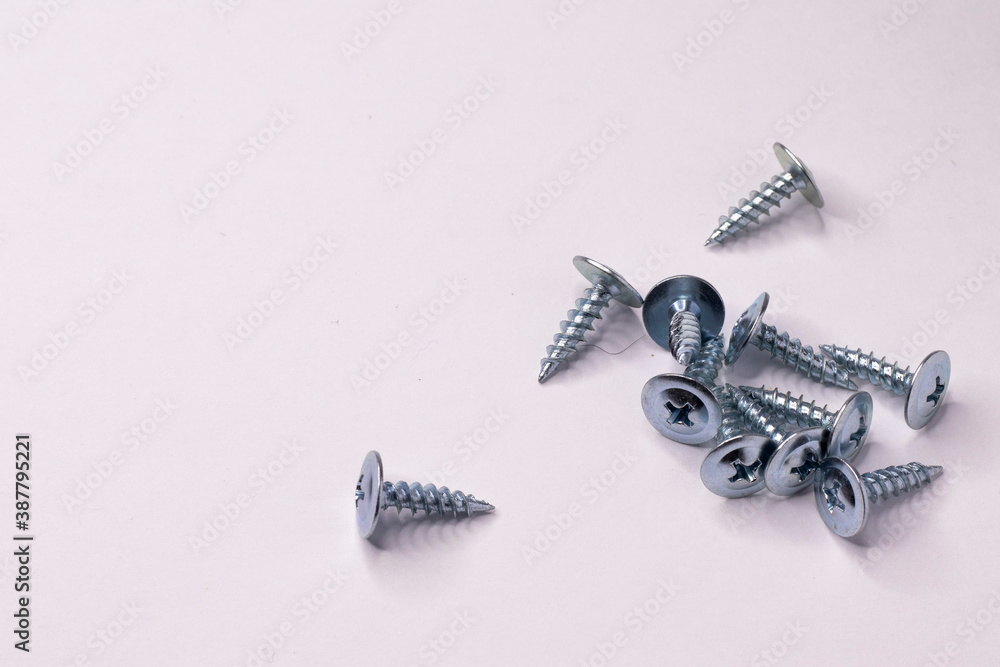 Small shiny self-tapping screws. Small shiny self-tapping screws.