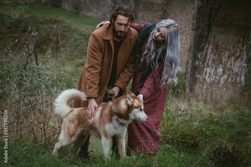 couple inlove with dog nead ancient bridge photo