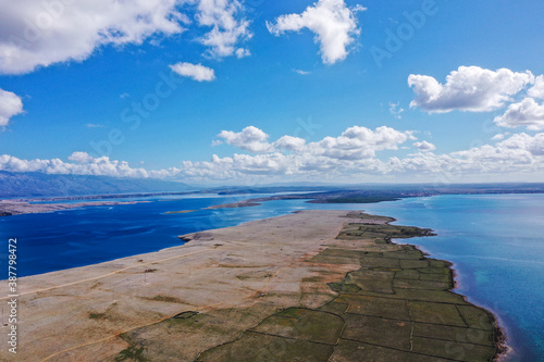 POVLJANA, PAG, CROATIA - OCTOBER 2020. - Aerial view of dry stone wall systems built for sheep breeding. Adriatic sea and islands. photo