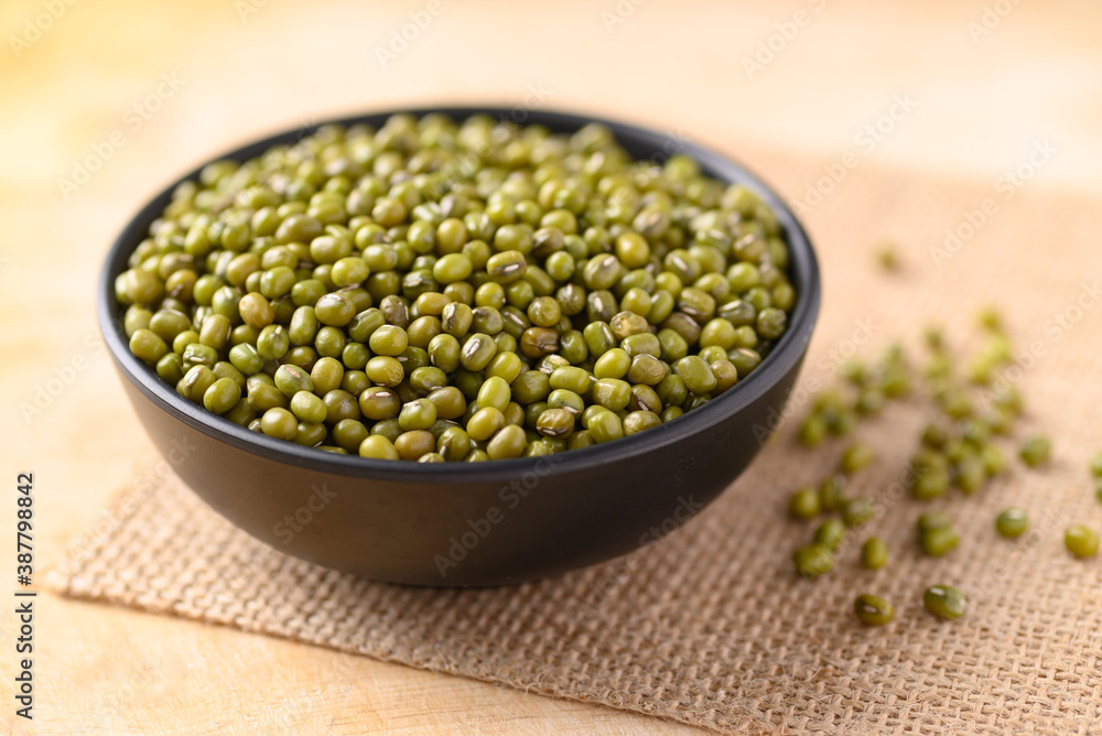 Mung bean in a bowl on wooden background Mung bean in a bowl on wooden background