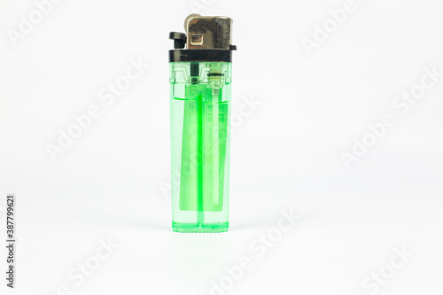 Green plastic gas disposable cigarette lighter isolated on white background with clipping path