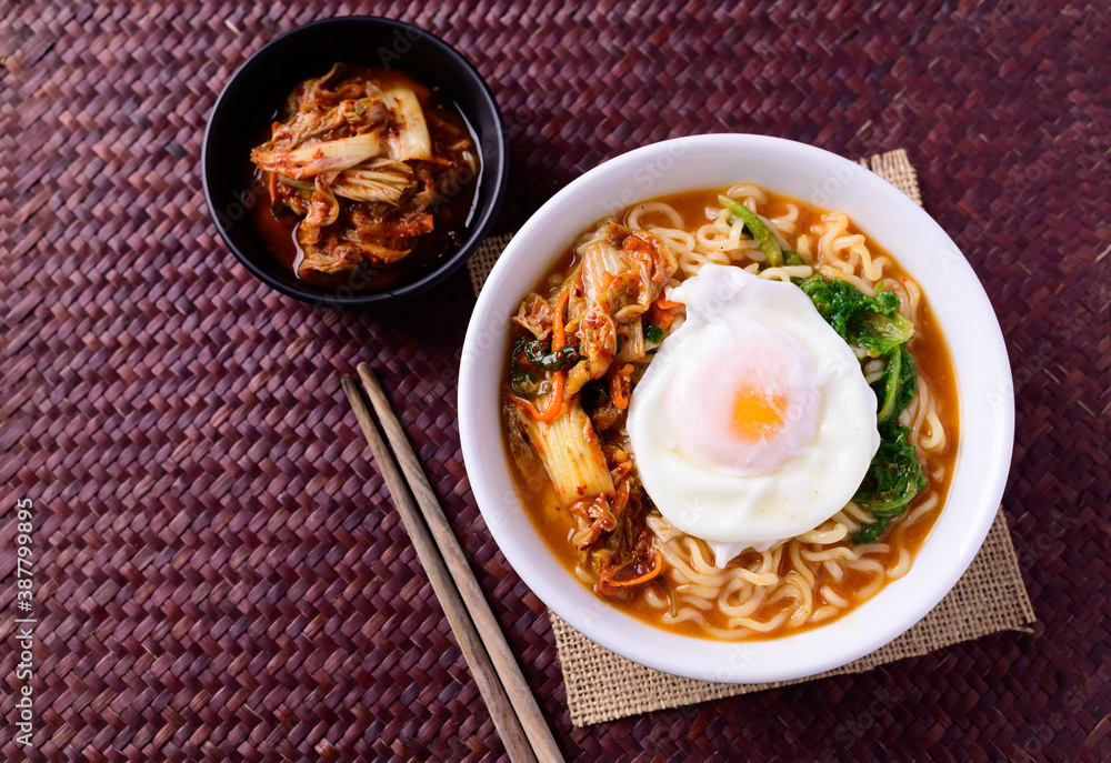 Korean food, Spicy noodles soup with kimchi and egg, Top view Korean food, Spicy noodles soup with kimchi and egg, Top view