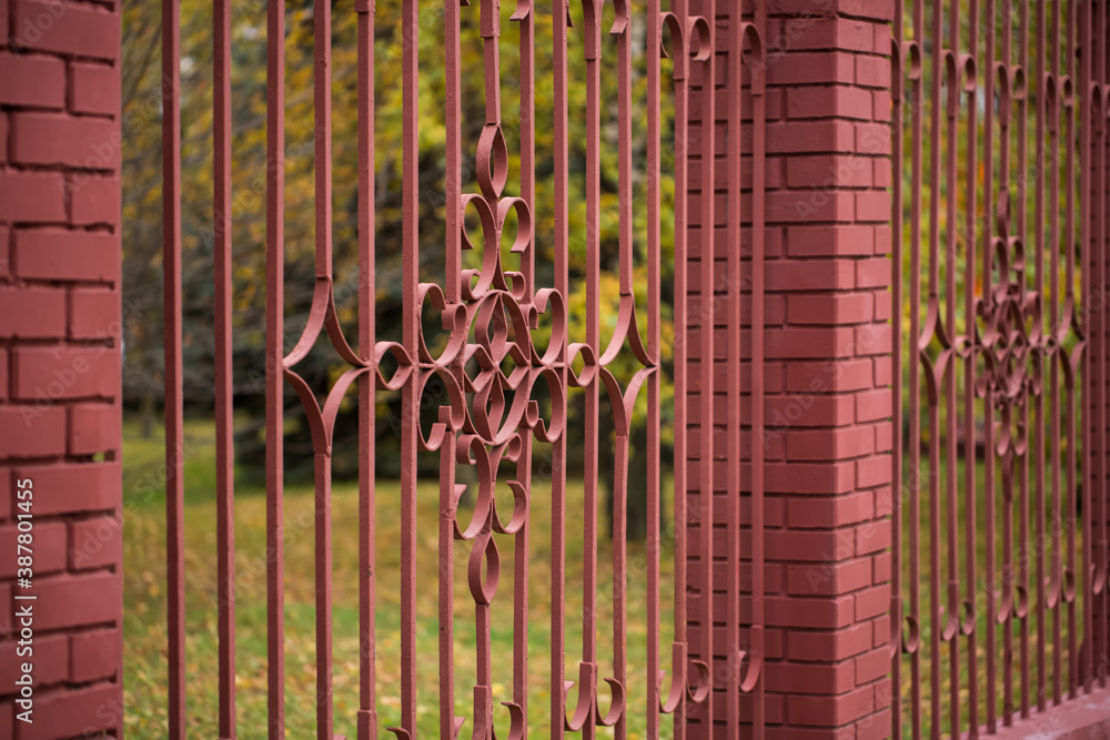Iron red fence around the building Iron red fence around the building