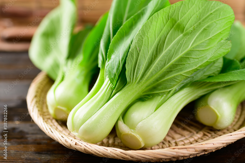 Fresh Bok Choy or Pak Choi(Chinese cabbage) in bamboo basket on wooden background, Organic vegetables Fresh Bok Choy or Pak Choi(Chinese cabbage) in bamboo basket on wooden background, Organic vegetables