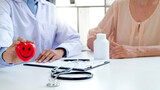 Doctor with patient in medical clinic or hospital.