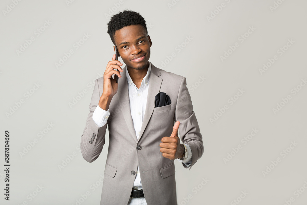 handsome young african male with mobile phone handsome young african male with mobile phone