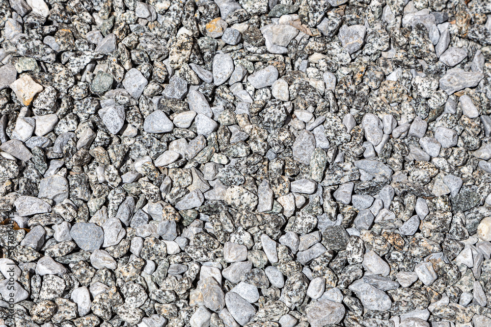 Natural background with small gray stones. Can be used in design as an abstract background, texture. Natural background with small gray stones. Can be used in design as an abstract background, texture.