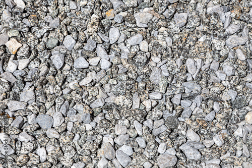 Natural background with small gray stones. Can be used in design as an abstract background, texture.