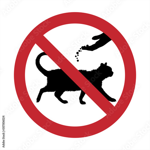 Vector silhouette of do not feeding cat mark on white background. Symbol of prohibition with animal.