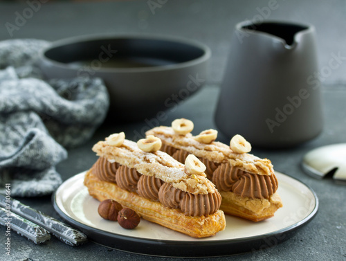 Bild auf Leinwand Homemade eclair with chocolate and nuts. Pastry.