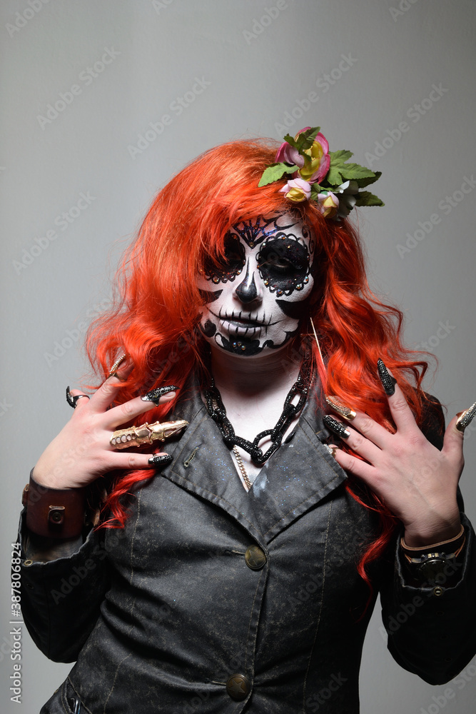 Fototapeta premium Zombie girl. Stodio portrait of female model with Halloween makeup. Halloween conception