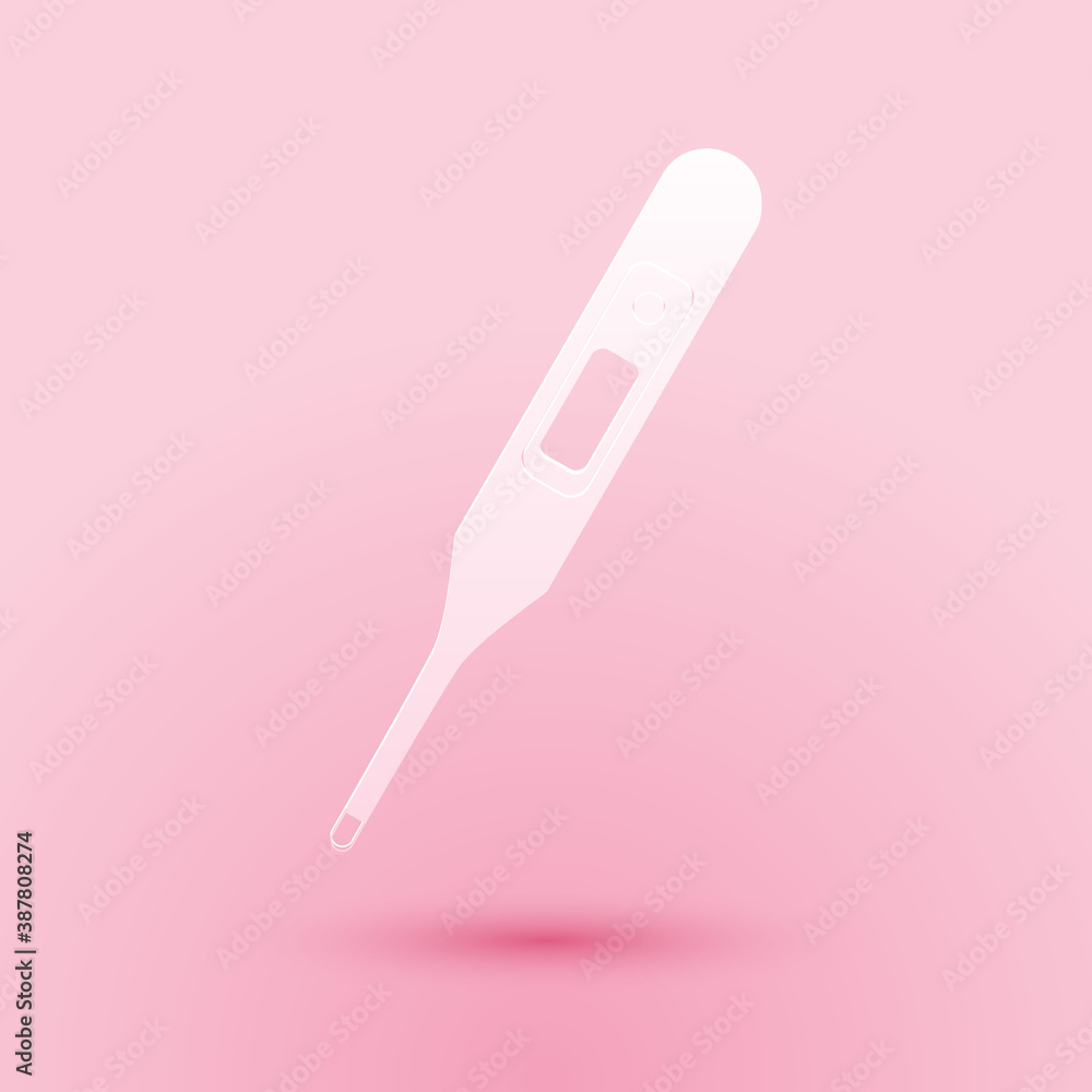 Paper cut Medical digital thermometer for medical examination icon isolated on pink background. Paper art style. Vector.