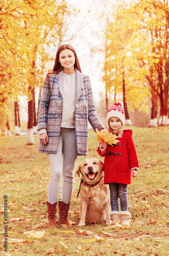 happy family with dog in sunny autumn park happy family with dog in sunny autumn park