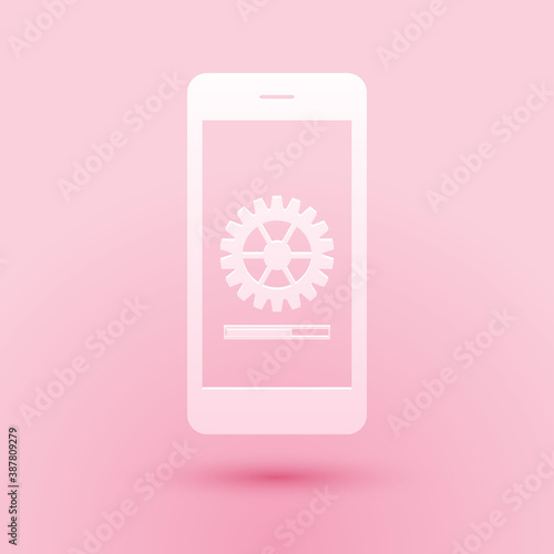 Paper cut Smartphone update process with gearbox progress and loading bar icon isolated on pink background. System software update and upgrade concept. Paper art style. Vector.