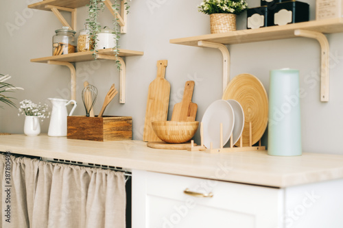 Kitchenware on the wooden table in modern bright kitchen. photo
