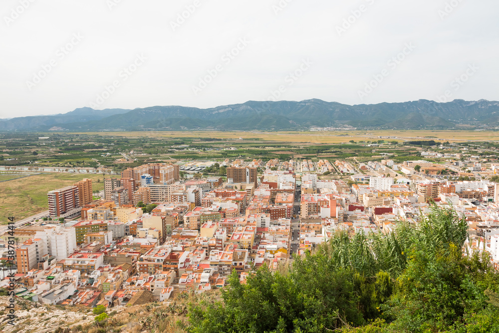 Cullera city from an aerial view. Beautiful panorama of the city and the mountains in the background.