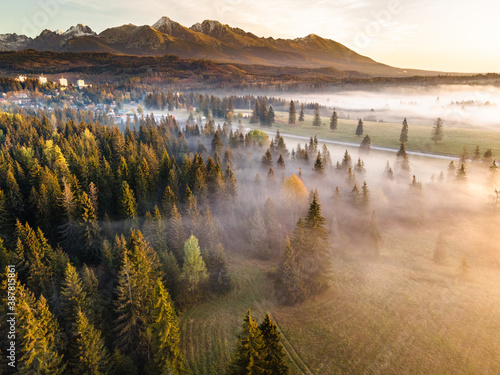 Beautiful Morning in High Tatras Mountains. Mist Over Fall Foliage. Aerial Drone View