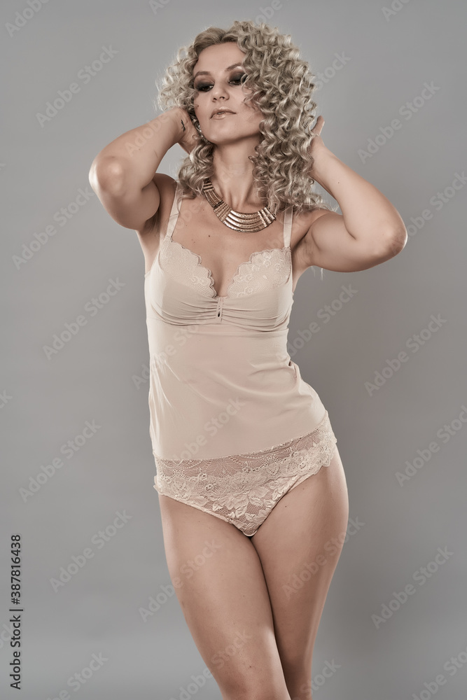 Glamour model with curly blond hair Glamour model with curly blond hair